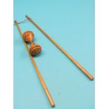 A Victorian Diabolo amusement, turned boxwood objective and two tapering wands, some damage to