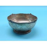 A silver bowl, with cast border,