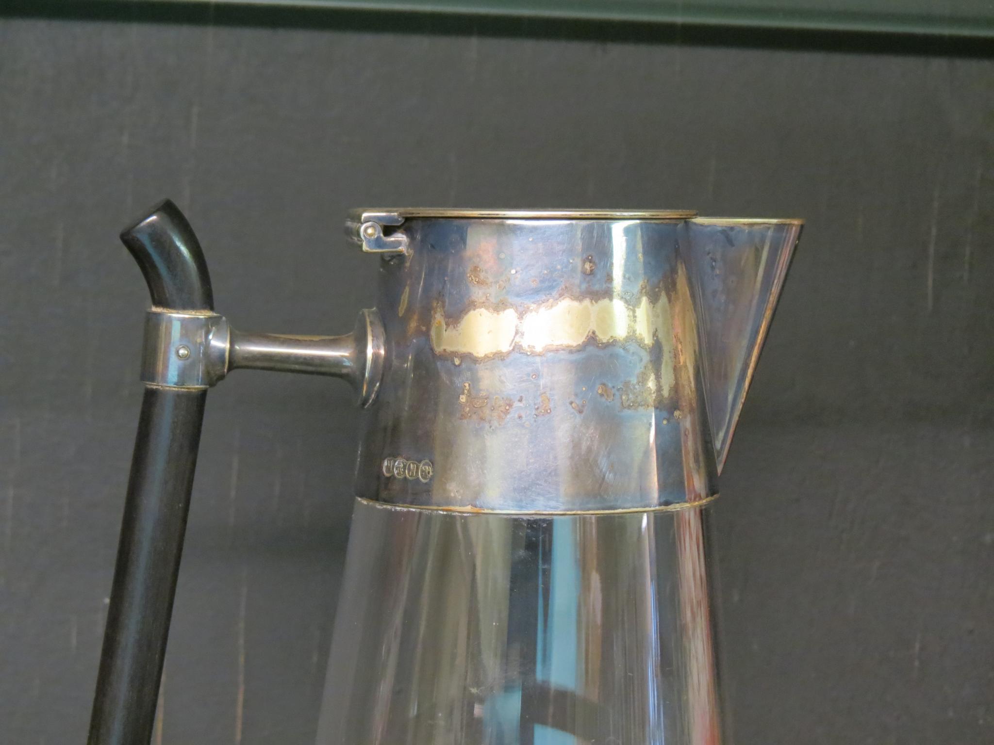 A Victorian claret jug designed by Christopher Dresser, tapering glass with silver plated mounts, - Image 2 of 2