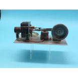 A scratch-built hot air Sterling engine, single cylinder on aluminium base, 11in.