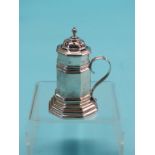 A Victorian Britannia Standard silver pepper pot, octagonal tapering form with single handle, London