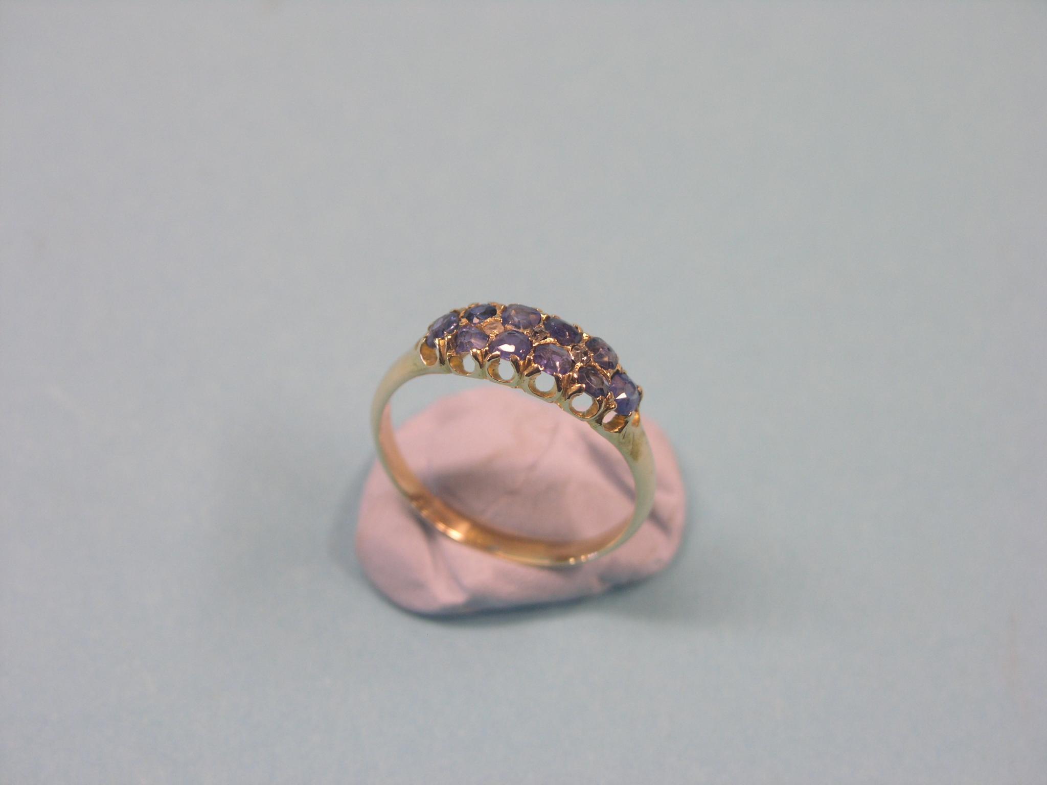 A yellow metal half-hoop ring, set ten Ceylon sapphires, size R