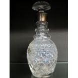 A silver-mounted glass decanter, bulbous-shape with mushroom stopper, 11.5in.