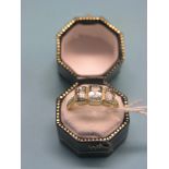 A 9ct. gold half-hoop ring, set three step-cut aquamarines, size P