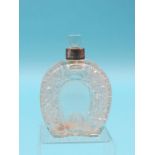 A late Victorian Asprey novelty scent bottle, horseshoe-shape with cut detail, with stopper,