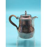 A George III silver chocolate pot, bellied form with hinged cover and wicker-mounted handle, John