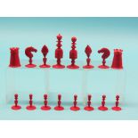 A late 19th century ivory chess set, red-stained and natural, Kings 3.25in. - one rook some