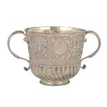 A molten, embossed and chiselled silver Porringer, silversmith Edward Wimans, London [...]