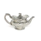 A teapot in molten, embossed and chiselled sterling silver, silversmith Benjamin [...]