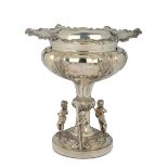 An embossed, molten and chiselled silver centrepiece, silversmiths Charles Thomas & [...]