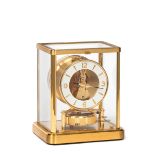 Jaeger-LeCoultre, "Atmos". Fine, gilt brass and glass Atmos clock wound by barometric [...]