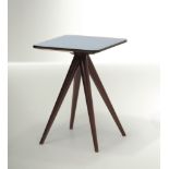 M. Ingrand, a table, Fontana Arte, 1950 ca. - A low table with wooden legs and a cut [...]