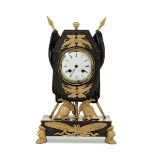 An "Empire" table clock, France, 19th century - Bronze and gilt bronze. Octagonal [...]