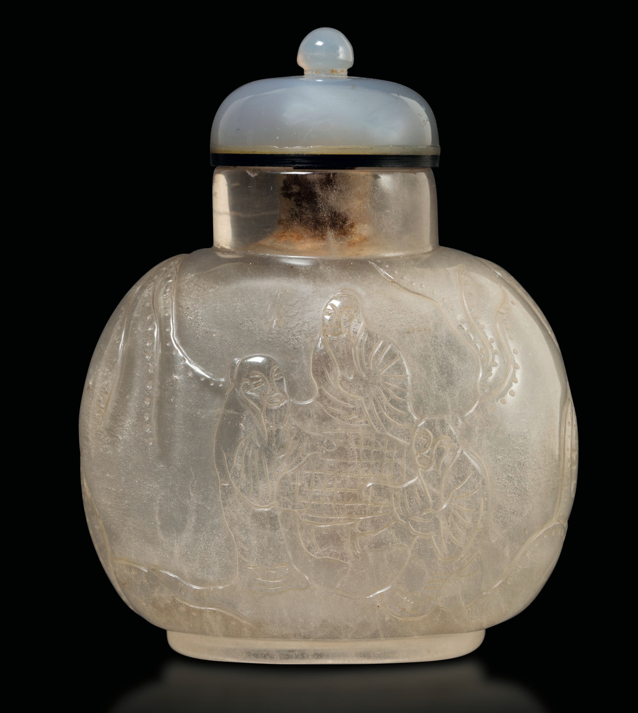 A rock crystal snuff bottle, China, 1800s - Carved with scenes of everyday life [...]