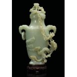 A lidded vase, China, 19th century - A Celadon jade vase with ring-shaped handles and [...]