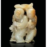 A small jade group, China, 20th century - White jade and russet. H 7cm - Startprice : [...]