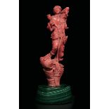 A coral figure, China, early 1900s - A young lad with a barrel, coral on a malachite [...]