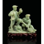 A jadeite group, China, Republic, 1900s - A carved jadeite group depicting working [...]