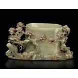 A jade bowl, China, Qing D., late 1800s - Celadon jade with an embossed naturalistic [...]