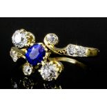 An early 20th Century 18ct gold mounted sapphire and diamond ring, the circular cut sapphire of