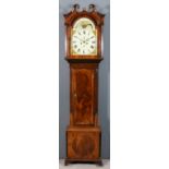 An early 19th Century mahogany longcase clock by J. Cottier of Peel, the 14ins arched painted dial