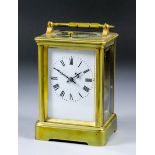 A late 19th Century French carriage clock, the white enamel dial with Roman numerals, to the eight