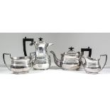 A George V silver rectangular four piece tea service with moulded rims, triple reeded band to bodies