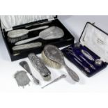 An Elizabeth II silver backed four piece dressing table set of "Art Deco" design, the backs with