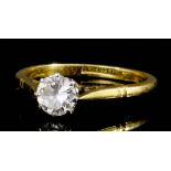 A 1920's 18ct gold and platinum mounted diamond solitaire, the old cut stone of approximately .