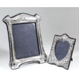 An Elizabeth II silver rectangular photograph frame with arched top and leaf and bead mounts,