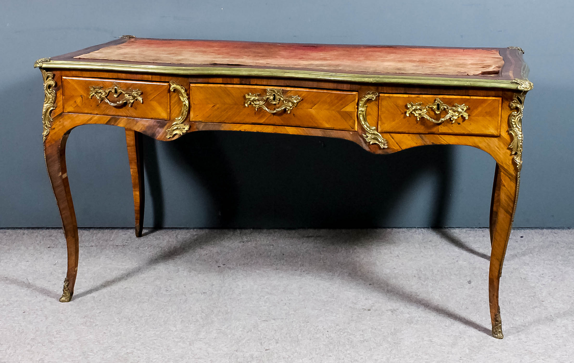 A late 18th/early 19th Century French kingwood and gilt brass mounted rectangular Bureau Plat of "