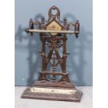A late Victorian cast iron and brass umbrella stand of "Aesthetic" design, 19ins x 7.75ins x 29ins