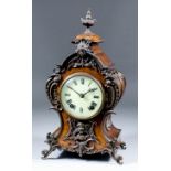 A late 19th/early 20th Century German stained wood and patinated brass mounted mantel clock of "