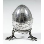 A 19th Century Russian silvery metal egg pattern purse, the exterior engraved with stylised