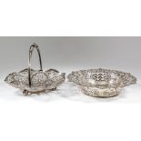 An Edward VII silver circular basket, the shaped and moulded rim with leaf scroll mounts and with