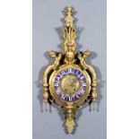 A late 19th Century French gilt brass and enamel Cartel clock, the 9ins diameter domed gilt brass