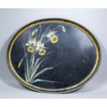 A 19th Century black and gilt tole oval tray, the centre painted with flowering daffodils, 24ins x