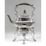 A late Victorian silver rectangular tea kettle and stand, the kettle with turned wood handle, on