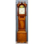 An early 19th Century oak and mahogany longcase clock by R.Wilson of Lincoln, the 12ins arched