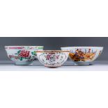 An Chinese Famille Rose export porcelain bowl enamelled with two long tailed birds, on stylised