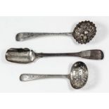 A late George III silver stilton cheese scoop by Richard Britton, London 1815, a silver sugar sifter