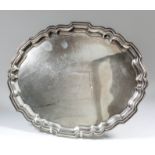 An Elizabeth II silver oval tray with shaped and moulded rim, 14ins x 11.5ins, by Barker Ellis