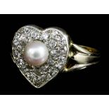 A modern gold coloured metal mounted pearl and diamond set heart pattern ring, the 5mm diameter