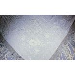 A Chinese cream silk embroidered shawl with deep fringed borders, 60ins (152.5cm) square (