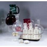 A plated rectangular six division cruet with loop handle, the rim with repousse flower ornament,