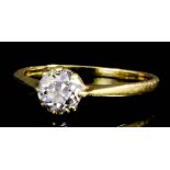 An 18ct gold and diamond mounted solitaire ring, the old cut stone of approximately .75ct (gross