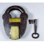 A large and impressive Georgian steel, iron, and brass padlock, with original key, 7.75ins high x