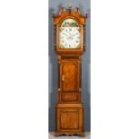 An early 19th Century oak and mahogany longcase clock by Richards of Uttoxeter, the 14ins arched