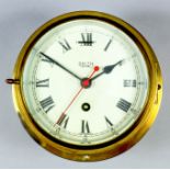 A Smith's "Astral" brass cased bulkhead timepiece with 6ins diameter painted metal dial with Roman