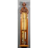 A late Victorian oak cased "Admiral Fitzroy's" barometer with exposed tube and mercury